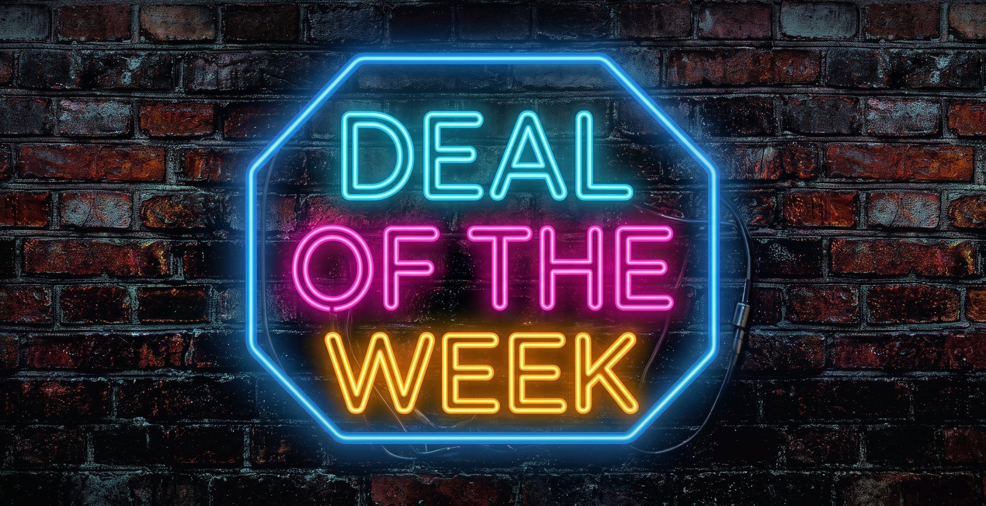 A glowing neon sign with the words 'DEAL OF THE WEEK' in bright cyan, pink, and orange-yellow lettering, mounted against a dark brick wall.