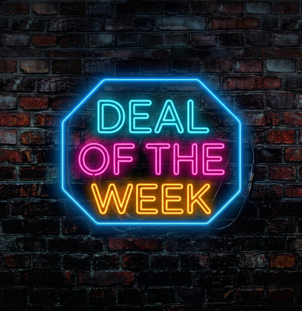 A glowing neon sign with an octagonal border and the words 'DEAL OF THE WEEK' in bright cyan, pink, and orange lettering, mounted against a dark brick wall.